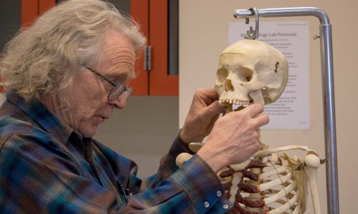 Anthropologist with Skull